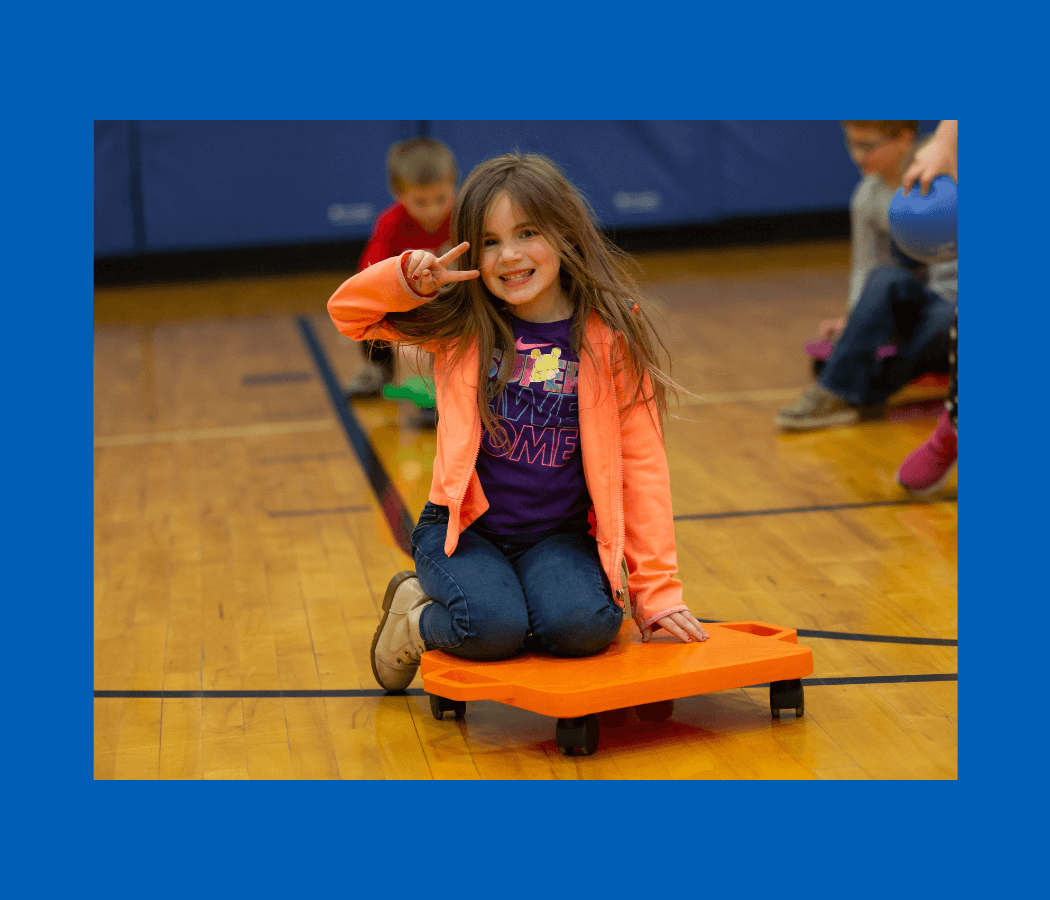 student playing in gym class