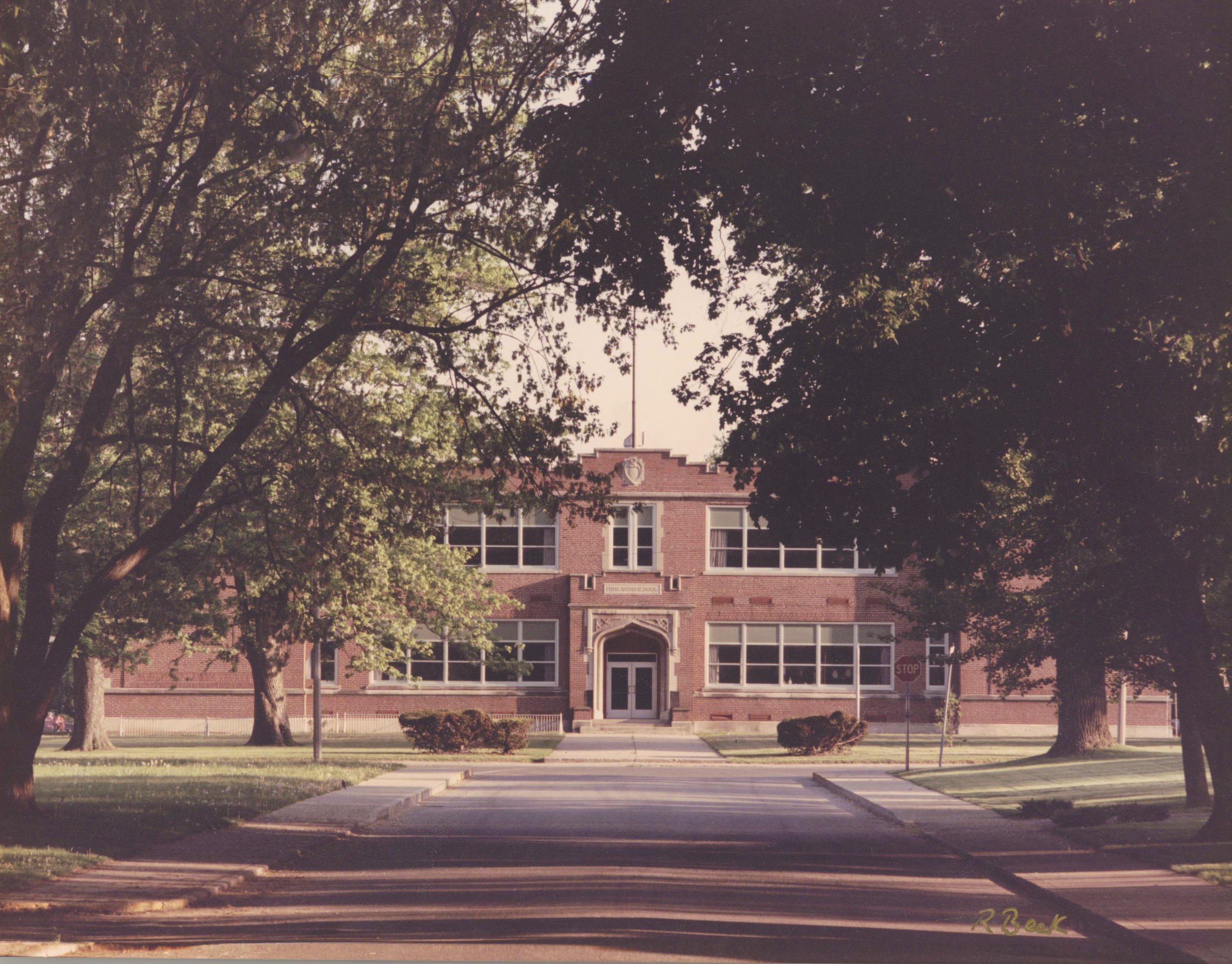 Gorgeous view of First Ward. Trees stand proudly in front of the two-story elementary school.