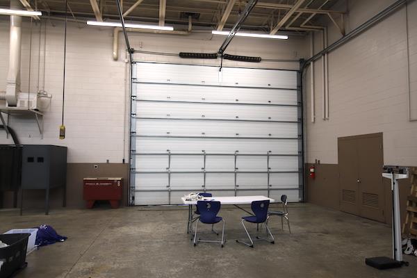 large garage-style door in the auto shop