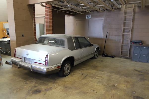 Old gray car that has been at TCSC for decades, probably