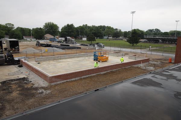 A more aerial view of the incomplete greenhouse--taken from atop the school's roof.