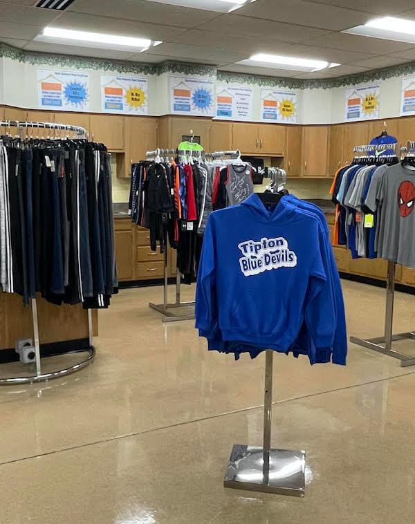 Several racks of boys clothing, ranging in sizes